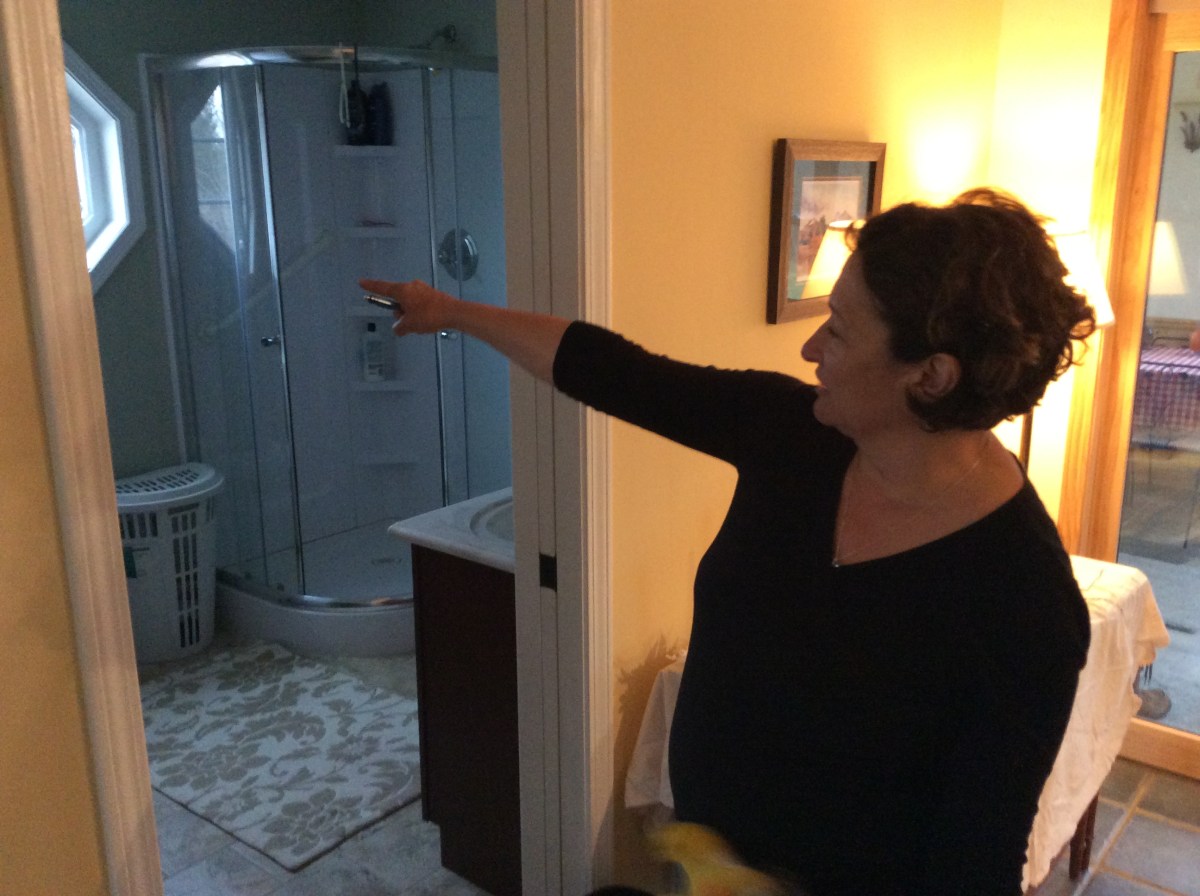 Knewstub's wife Linda shows the bathroom she added onto the house while Fred was hospitalized.